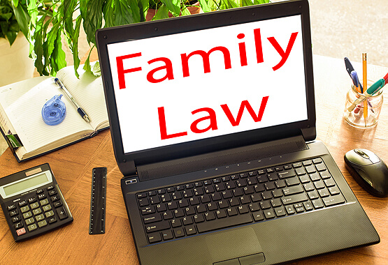 black computer on desk with screen saying family law