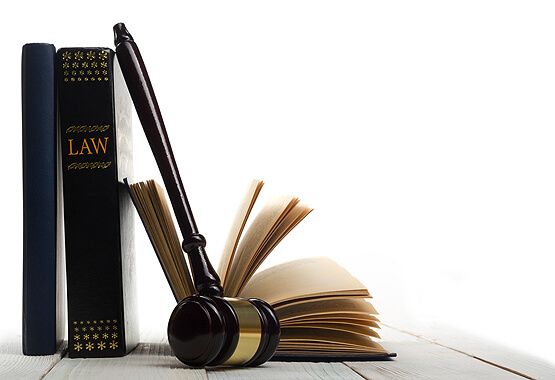 law books and a gavel sitting on a table