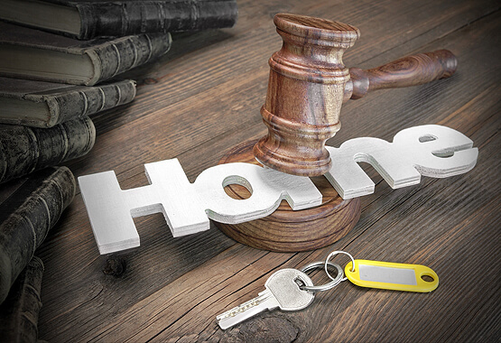 gavel tapping on the word home