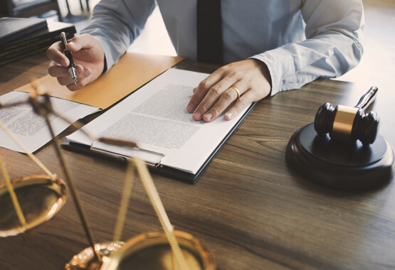 man in a suit with a contract