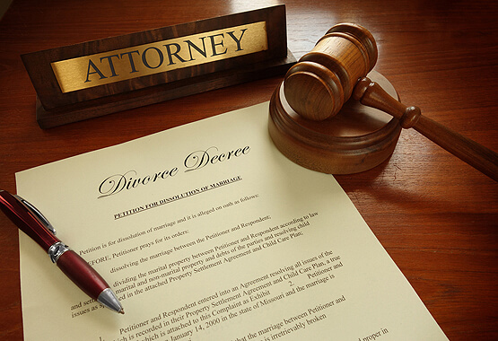 attorney nameplate wooden gavel and divorce contract on a table