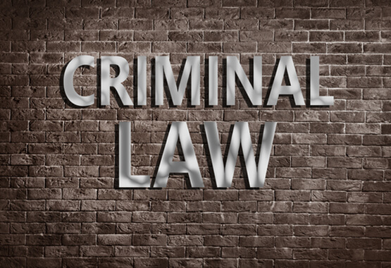 brick wall with criminal law sign