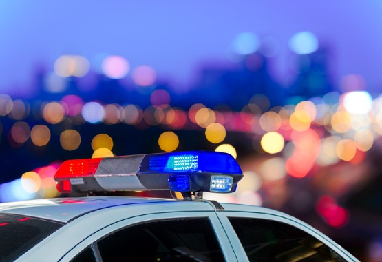 A police car with its sirens and lights on