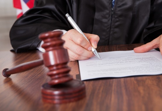 A judge going over a case presented by Divorce Lawyers in East Peoria IL
