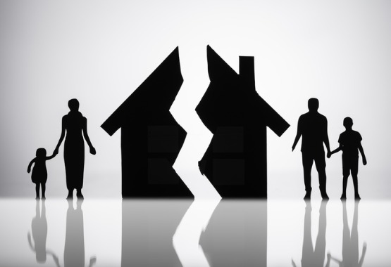 A silhouette of a family on either side of a broken house, representing Family Law in East Peoria IL