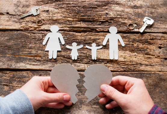 Paper cutout of a family with 2 children and a broken heart, representing a Child Custody Lawyer in Pekin IL