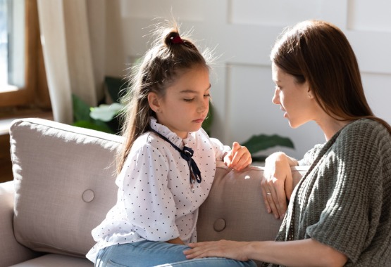 A girl talking with her mother after talking with a DCFS Attorney in Peoria IL