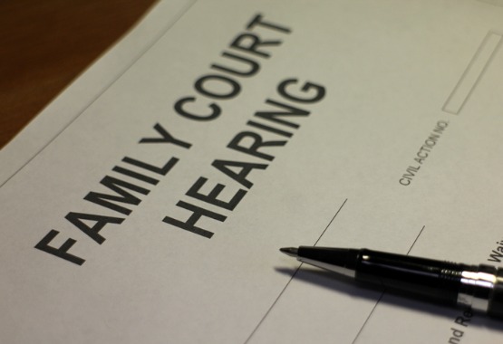 Family court hearing paperwork represents the need to hire a Juvenile Lawyer in Pekin IL