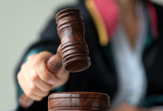 A judge hits her gavel during a case involving a Juvenile Lawyer in Peoria IL