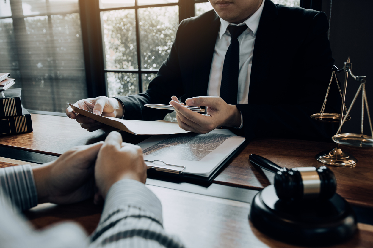 An attorney discussing the terms of an Order of Protection with their client in Peoria IL