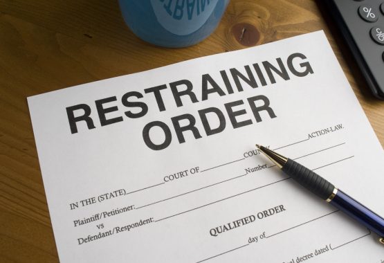 A restraining order on a desk, waiting to be filled out by an attorney in Central Illinois